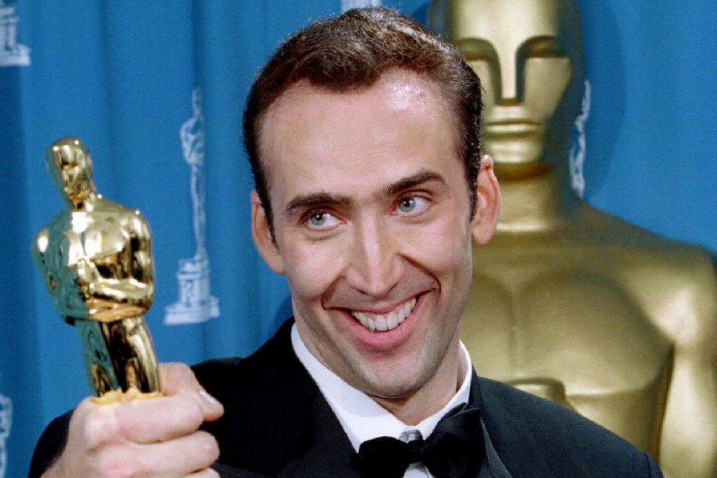 Actor Nicolas Cage gives holds his Oscar statuette after winning an Academy Award as best actor for ..