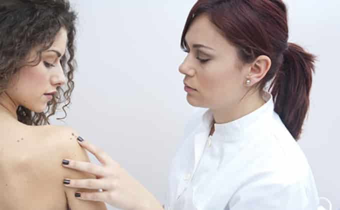 woman at dermatology examination