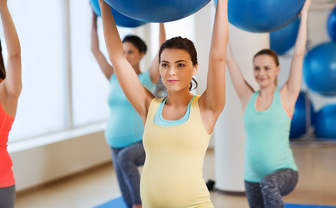 pregnancy, sport, fitness, people and healthy lifestyle concept