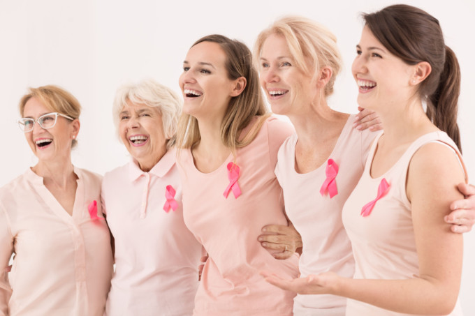 66120879 - happy breast cancer survivors supporting each other