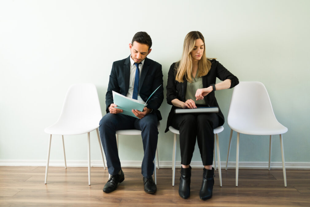 Anxious professional woman and man applying for a job