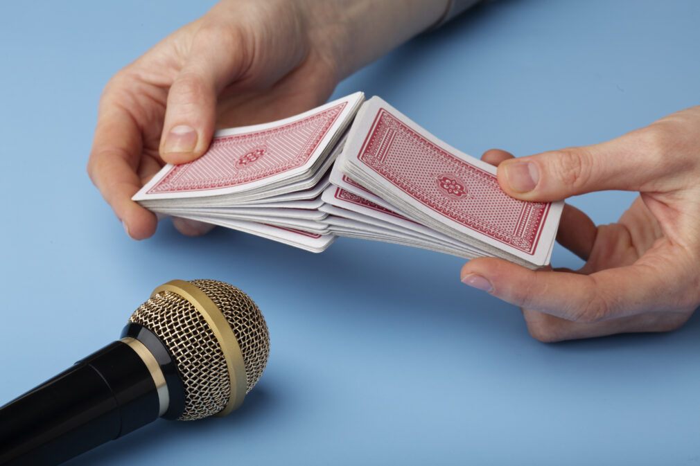 person-using-deck-of-playing-cards-close-to-microphone-for-asmr